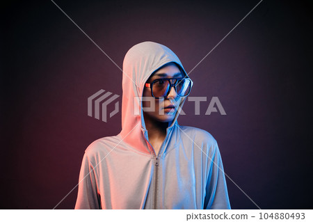woman wearing sport wear jacket and sunglasses looking at side 104880493