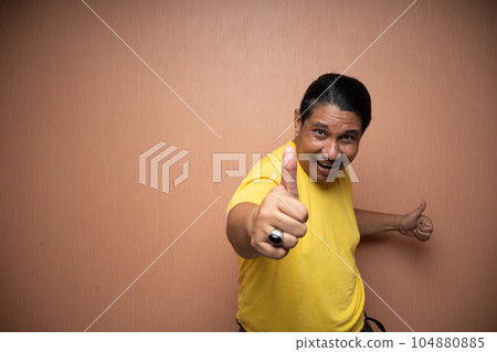 old asian man with thumbs up gesture showing agreement of something old asian man with thumbs up gesture showing agreement of something 104880885