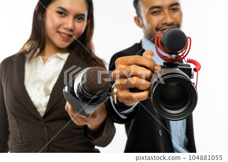 a male journalist standing beside a female journalist a male journalist standing beside a female journalist 104881055