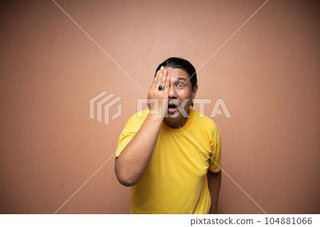 old asian man covering his half eyes with his right hand old asian man covering his half eyes with his right hand 104881066