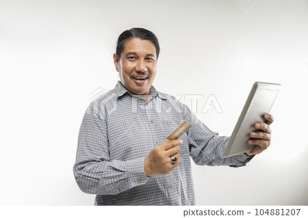 old asian man standing holding credit card and tablet white background old asian man standing holding credit card and tablet white background 104881207