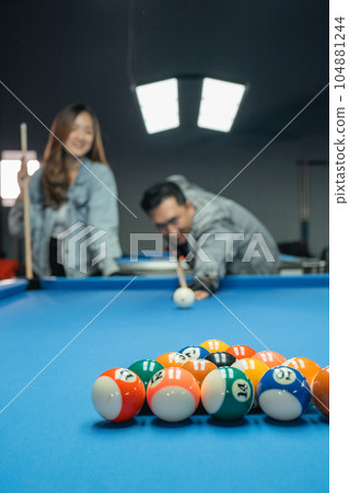 fifteen billiard balls aimed by the male billiard playerplayer fifteen billiard balls aimed by the male billiard playerplayer 104881244