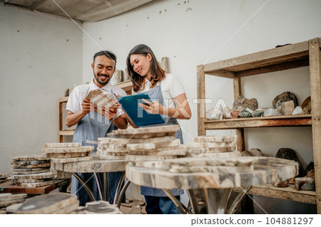 man and woman stone craft entrepreneurs checking cut stone crafts man and woman stone craft entrepreneurs checking cut stone crafts 104881297