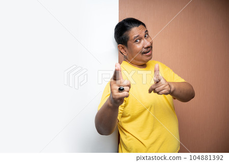 old asian man standing beside empty whiteboard with pointing gesture old asian man standing beside empty whiteboard with pointing gesture 104881392