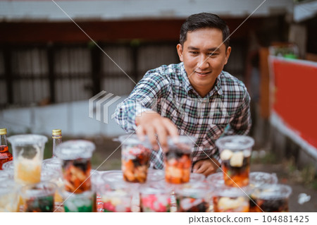 street food vendor sell fruit beverage on plastic cup street food vendor sell fruit beverage on plastic cup 104881425