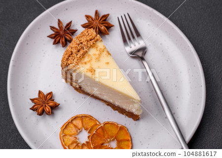 Delicious sweet cheesecake cake on textured concrete background Delicious sweet cheesecake cake on textured concrete background 104881617