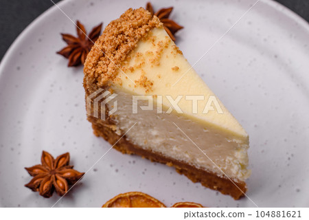 Delicious sweet cheesecake cake on textured concrete background 104881621