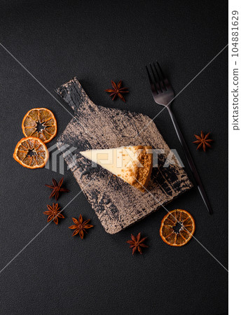 Delicious sweet cheesecake cake on textured concrete background 104881629