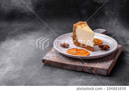 Delicious sweet cheesecake cake on textured concrete background 104881630