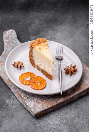 Delicious sweet cheesecake cake on textured concrete background 104881641