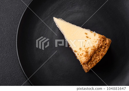 Delicious sweet cheesecake cake on textured concrete background 104881647
