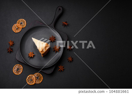 Delicious sweet cheesecake cake on textured concrete background Delicious sweet cheesecake cake on textured concrete background 104881661
