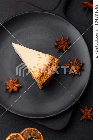 Delicious sweet cheesecake cake on textured concrete background Delicious sweet cheesecake cake on textured concrete background 104881668