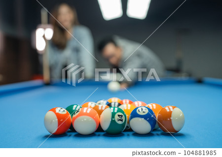fifteen billiard balls neatly arranged on the billiard table 104881985