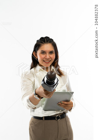 a beautiful journalist standing handed over a microphone 104882378