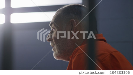 Criminal sits on bed and dreams about freedom Criminal sits on bed and dreams about freedom 104883306
