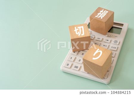 Block and calculator written as loss cut Block and calculator written as loss cut 104884215