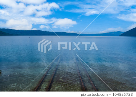 Hokkaido, train tracks sinking towards the bottom of the lake Hokkaido, train tracks sinking towards the bottom of the lake 104885728