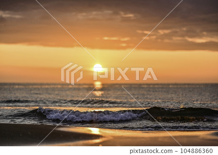 Uchinada beach sunset in spring Uchinada beach sunset in spring 104886360