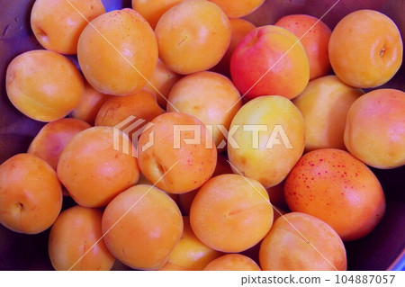 Raw apricots Raw apricots 104887057