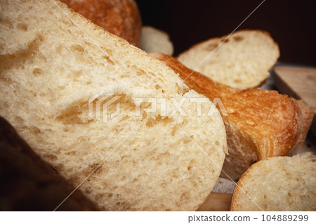 Cut bread assortment for a background, close up Cut bread assortment for a background, close up 104889299