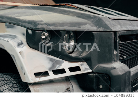 Close up of a car in car service prepared for repair 104889335
