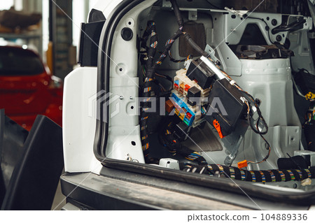 Electric wiring system with colorful wires in the car 104889336