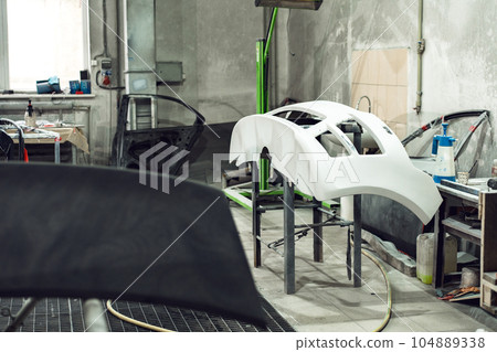 Spare parts for the car body in car repair service Spare parts for the car body in car repair service 104889338