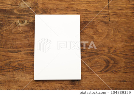 Blank businesscard stacks on rough wooden table Blank businesscard stacks on rough wooden table 104889339