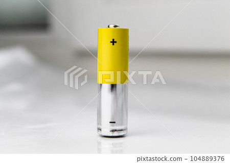 Battery. Alkaline battery on a white background. Battery. Alkaline battery on a white background. 104889376