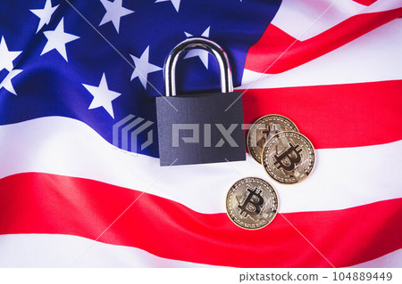 Bitcoins in the USA. Cryptocurrency ban in America.Usa flag and bitcoin coin. Bitcoins in the USA. Cryptocurrency ban in America.Usa flag and bitcoin coin. 104889449