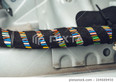 Electric wiring system with colorful wires in the car Electric wiring system with colorful wires in the car 104889450