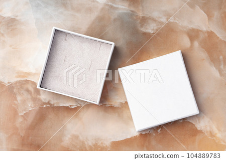White jewelry box on a white marble background 104889783