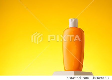 Cosmetic bottle with sunscreen lotion on yellow background 104890907