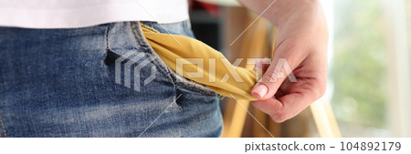 Jobless woman showing empty pocket, no money gesture. Jobless woman showing empty pocket, no money gesture. 104892179