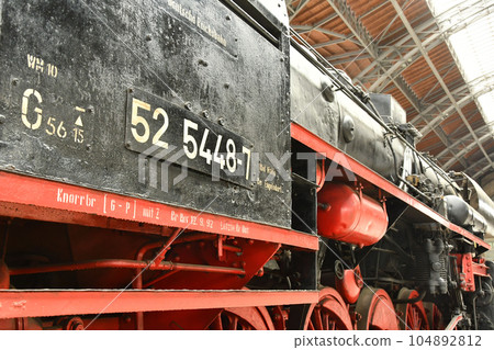 Closeup shot of a historic traditional locomotive at the museum station Closeup shot of a historic traditional locomotive at the museum station 104892812