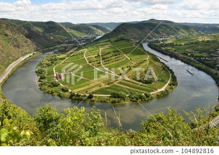 Bird's eye view of the Moselle loop surrounded by greenery and vineyards in Germany 104892816