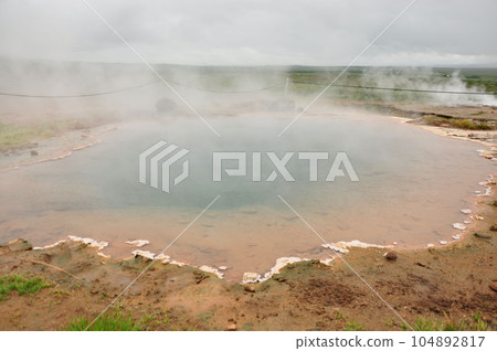 Hot springs near the Strokkur geyser in Iceland 104892817
