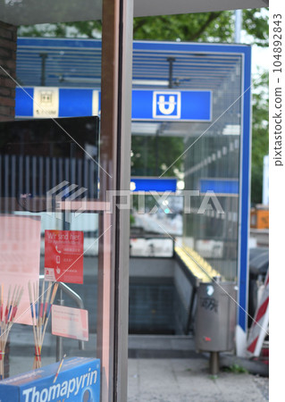 Entry to underground train in Bochum. Shot through a shop window. 104892843