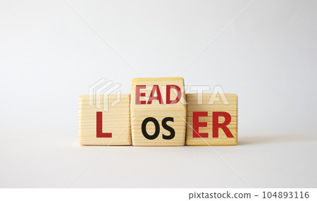 Leader vs Loser symbol. Wooden cubes with words Loser and Leader. Beautiful white background. Leader vs Loser and business concept. Copy space 104893116