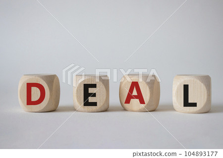 Deal symbol. Concept word Deal on wooden cubes. Beautiful white background. Business and Deal concept. Copy space. Deal symbol. Concept word Deal on wooden cubes. Beautiful white background. Business and Deal concept. Copy space. 104893177