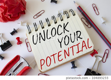Unlock your Potential symbol. Concept words Unlock your Potential on white notebook. Beautiful white background. Business and Unlock your Potential concept. Copy space. 104893233