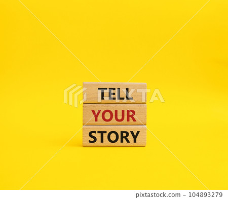 Tell your story symbol. Wooden blocks with words Tell your story. Beautiful yellow background. Business and Tell your story concept. Copy space. 104893279
