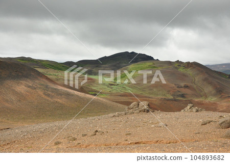 Beautiful view of the crater landscape and green peaks near Hverir, Iceland Beautiful view of the crater landscape and green peaks near Hverir, Iceland 104893682