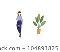 A woman who talks on a smartphone and a foliage plant 104893825