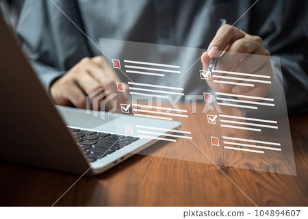 man chooses questionnaire with checkbox, survey form online, answer questions in the exam of test business checklist and filling survey form online using technology for education, learning. man chooses questionnaire with checkbox, survey form online, answer questions in the exam of test business checklist and filling survey form online using technology for education, learning. 104894607