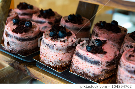 Image of tasty sponge cake dessert with beriies cream Image of tasty sponge cake dessert with beriies cream 104894702