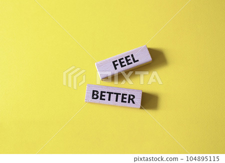 Feel better symbol. Wooden blocks with words Feel better. Beautiful yellow background. Business and Feel better concept. Copy space. Feel better symbol. Wooden blocks with words Feel better. Beautiful yellow background. Business and Feel better concept. Copy space. 104895115