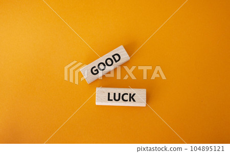 Good luck symbol. Wooden blocks with words Good luck. Beautiful orange background. Business and Good luck concept. Copy space. Good luck symbol. Wooden blocks with words Good luck. Beautiful orange background. Business and Good luck concept. Copy space. 104895121