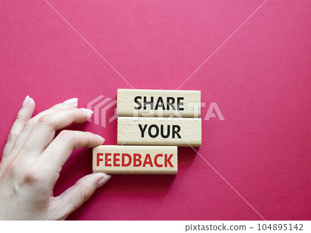Feedback symbol. Concept word Share your feedback on wooden blocks. Businessman hand. Beautiful red background. Business and Ask for feedback concept. Copy space Feedback symbol. Concept word Share your feedback on wooden blocks. Businessman hand. Beautiful red background. Business and Ask for feedback concept. Copy space 104895142